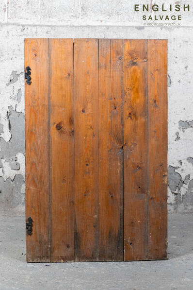 An old cupboard pine plank door