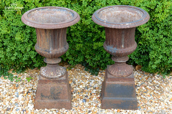 Antique cast iron Campana urns on plinths
