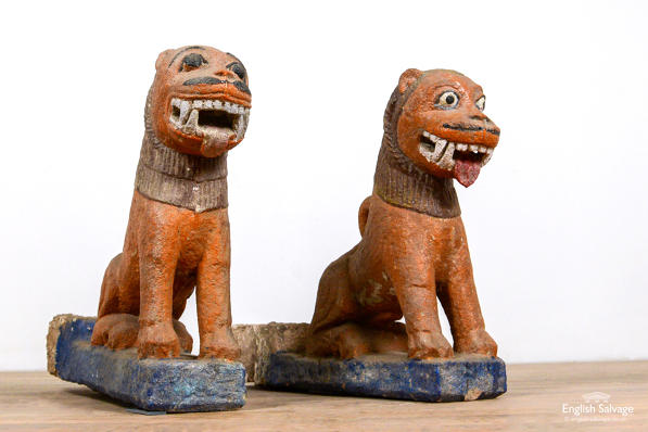 Antique hand-carved painted stone tigers 