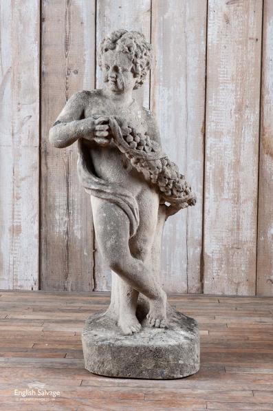 Antique limestone C19th putto statue