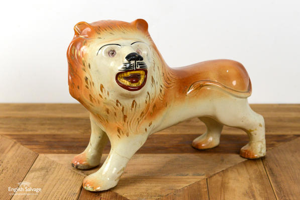 Antique pottery statue of a lion