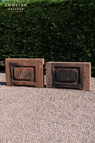 Antique sandstone boys and girls school signs