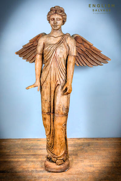 Antique tall statue of a wooden angel