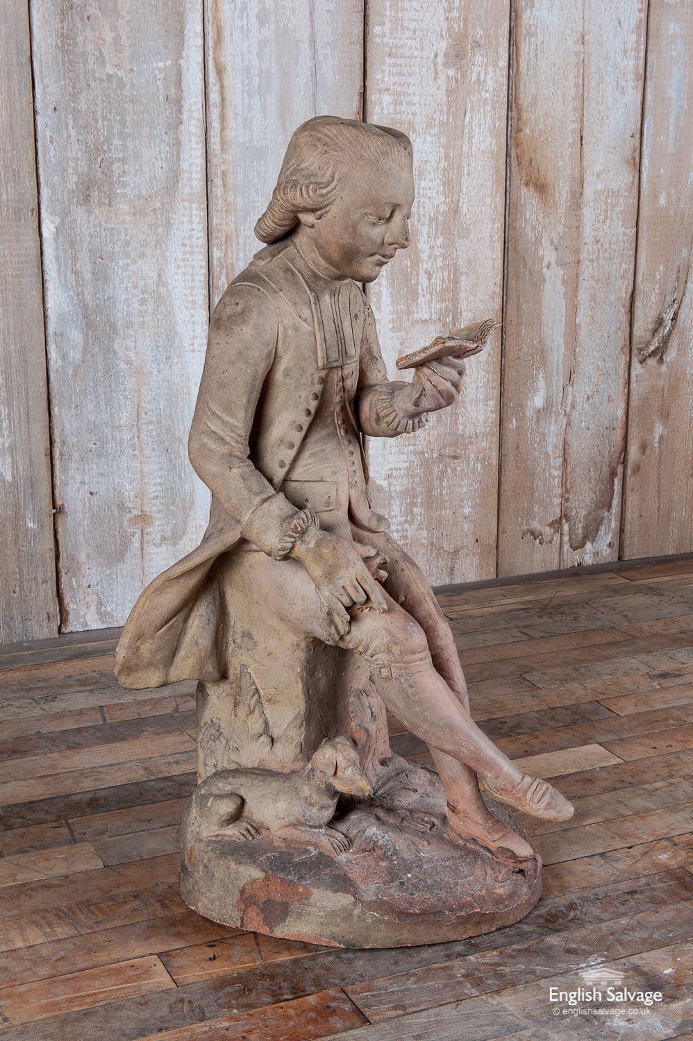 Antique terracotta sculpture of a reader