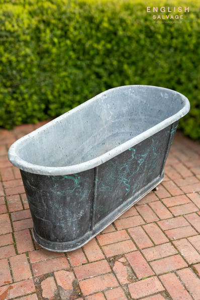 Antique zinc marbleised bath on castors