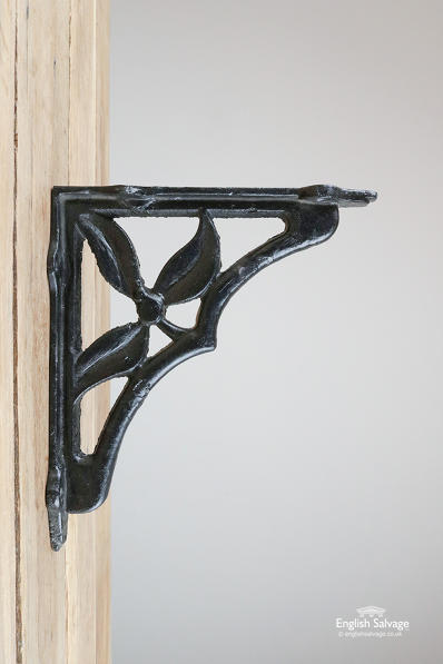 Black cast iron brackets with leaf detailing