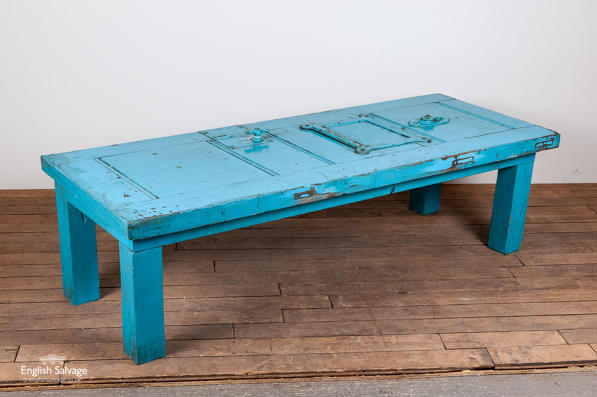 Blue table made from an old jail door 