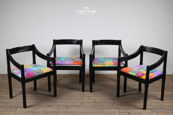 Brightly coloured fabric seat black chairs