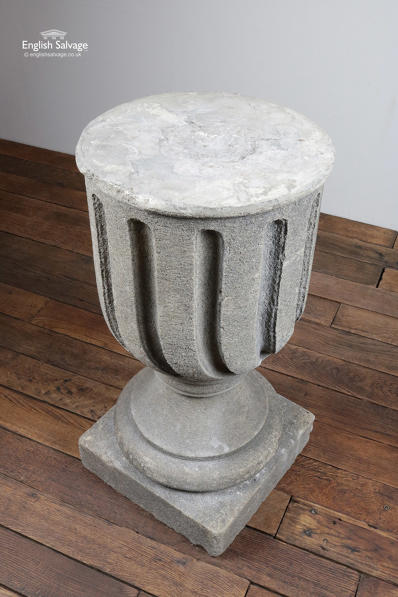 Carved urn shaped composition stone plinth