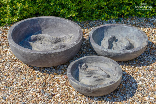 Cast garden bowls with fish in the bottom