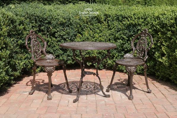 Cast iron garden table and two chairs
