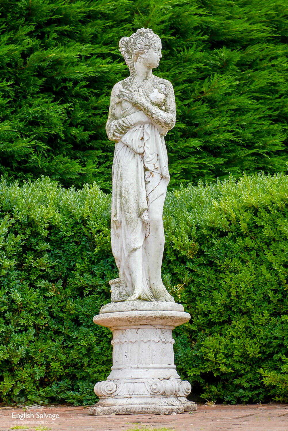 Classical female nude garden statue on plinth