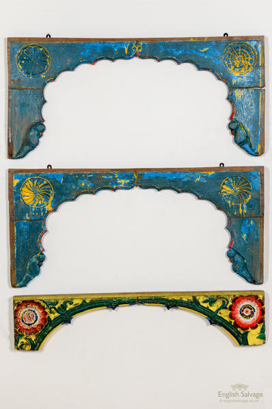 Colourfully painted carved wooden arch frames