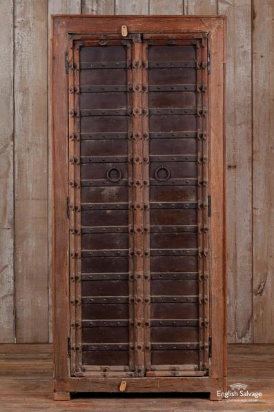 Dark hardwood cupboard with antique doors