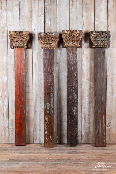 Four antique teak pillars with capitals
