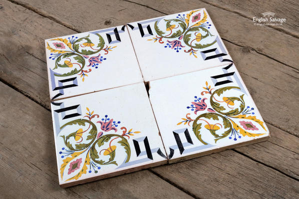 Four Salvaged Colourful Floral Glazed Tiles