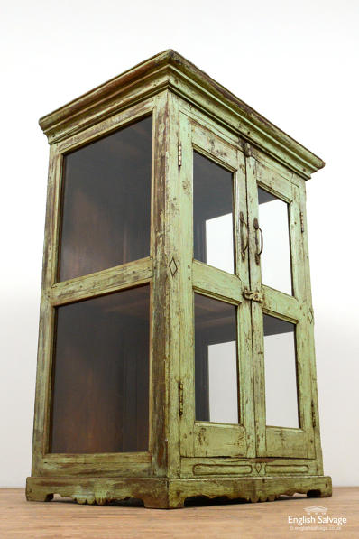 Green glass front low wooden display cabinet