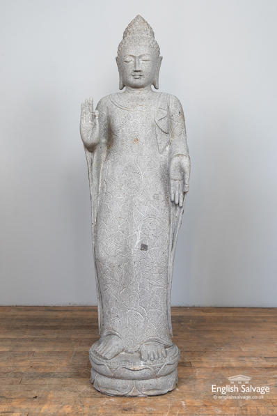 Hand-carved stone standing Buddha statue