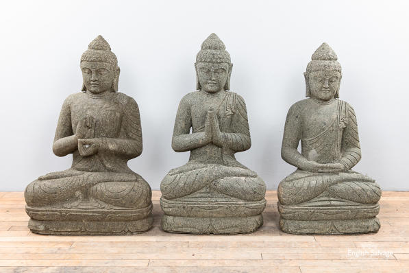 Hand-carved volcanic basanite rock Buddhas