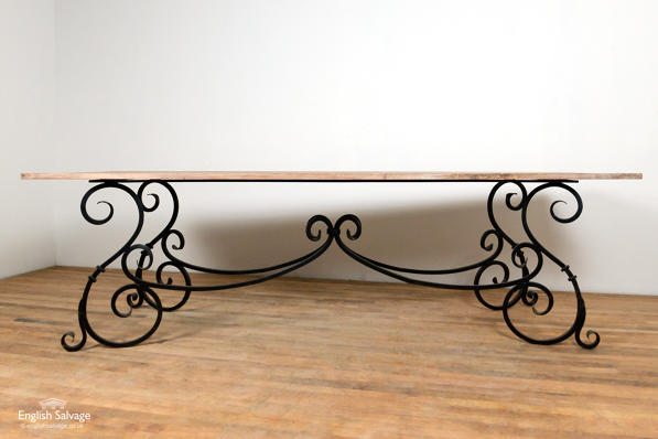 Hardwood and scrolled wrought iron table