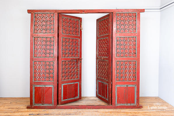Impressive deep red Jali screen and doors