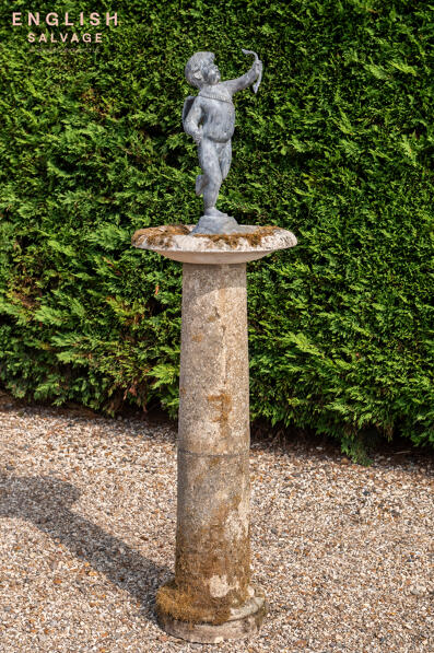 Lead cherub on composition stone birdbath