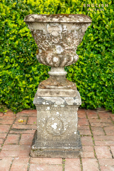 Old single ornate composition stone urn