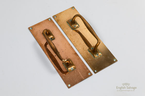 Original brass door pulls on large backplates