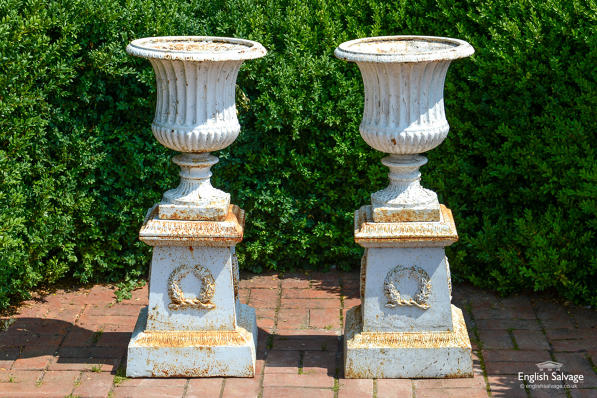Original cast iron campana urns on plinths