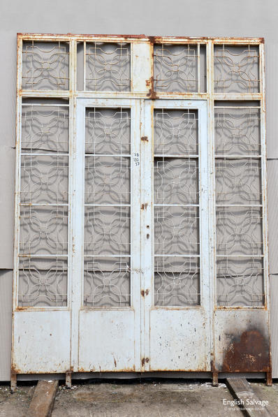 Ornate iron scrollwork screen with doors