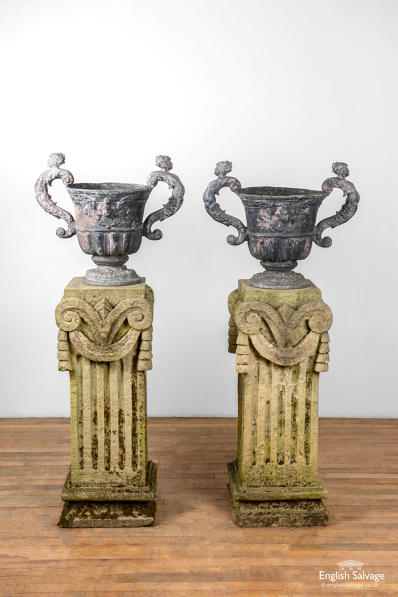 Pair of Georgian lead urns on stone bases 