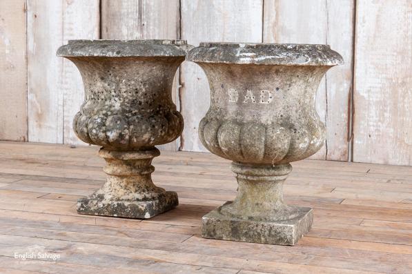 Pair of semi-gadrooned  marble urns 