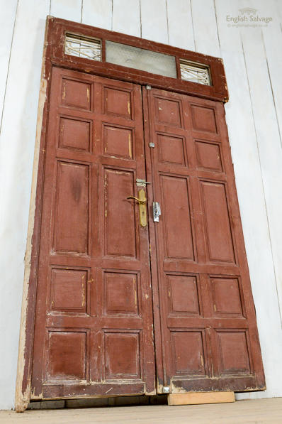 Panelled double doors in toplight frame