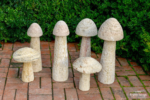Quirky carved stone mushroom garden statues