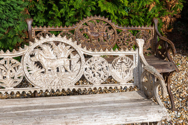 Reclaimed cast iron and teak dog benches