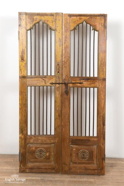 Reclaimed hardwood and iron Jali doors