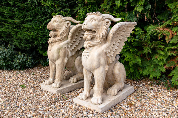 Reclaimed pair of composition griffins
