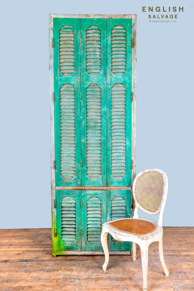 Reclaimed wooden window with louvred shutters
