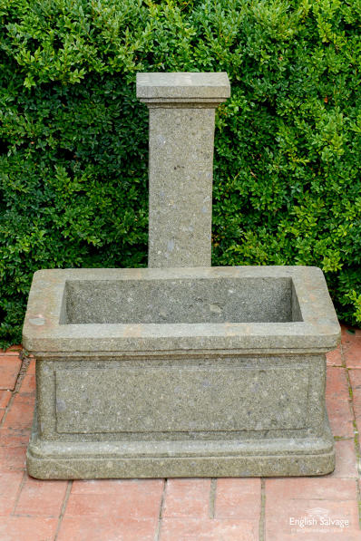 Rectangular carved stone wall fountain trough