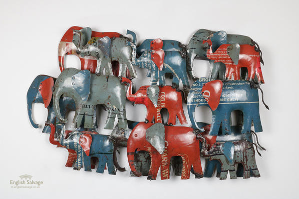 Recycled metal wall art of herd of elephants