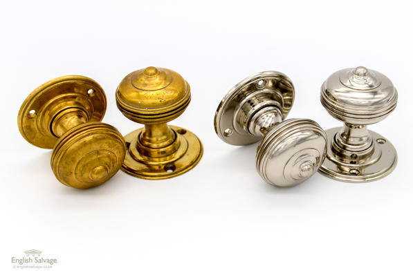 Ringed brass and chrome pairs of door knobs