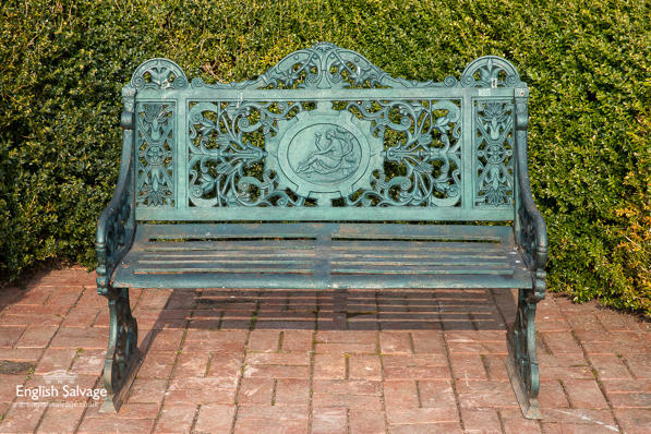 Salvaged cast bench with classical image