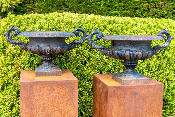 Salvaged cast iron handled urns