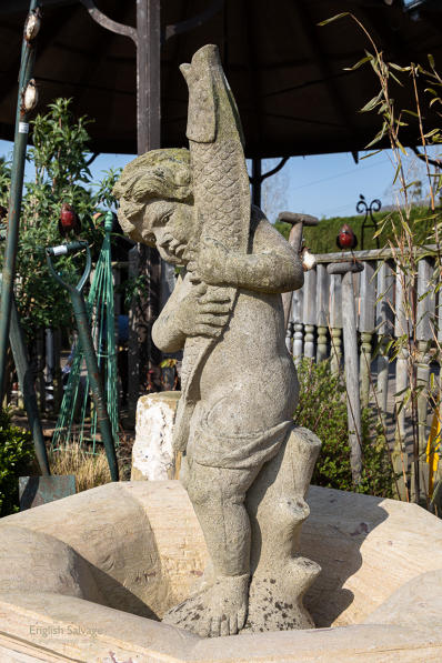 Salvaged hand-carved stone fountain spout