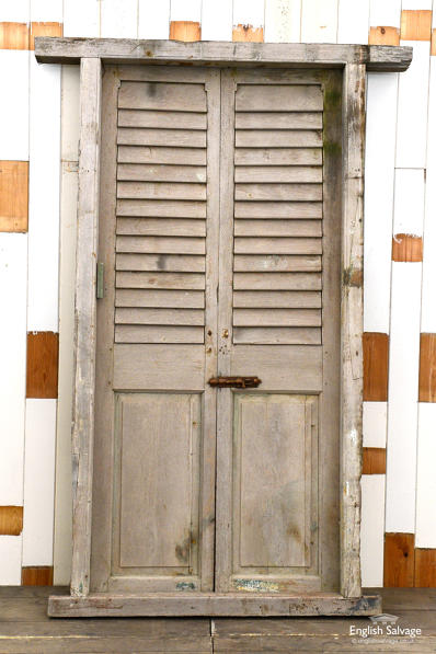 Salvaged teak louvre doors in frame