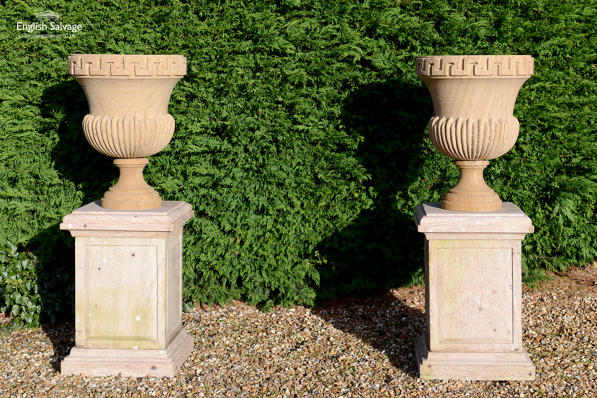 Sandstone urns with Greek key design
