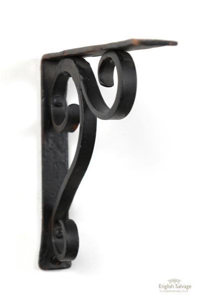 Scrolled wrought iron wall mounted bracket
