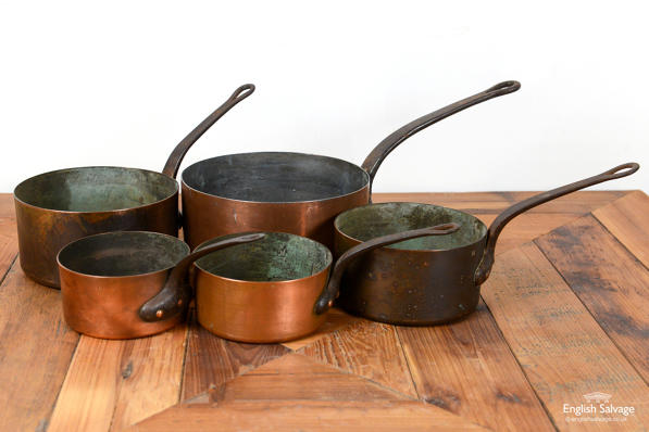 Set of five antique copper saucepans