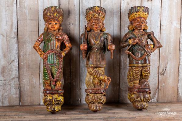 Set of three carved wooden figures / corbels