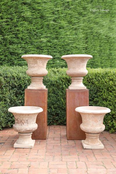 Simple terracotta urns with aged finish